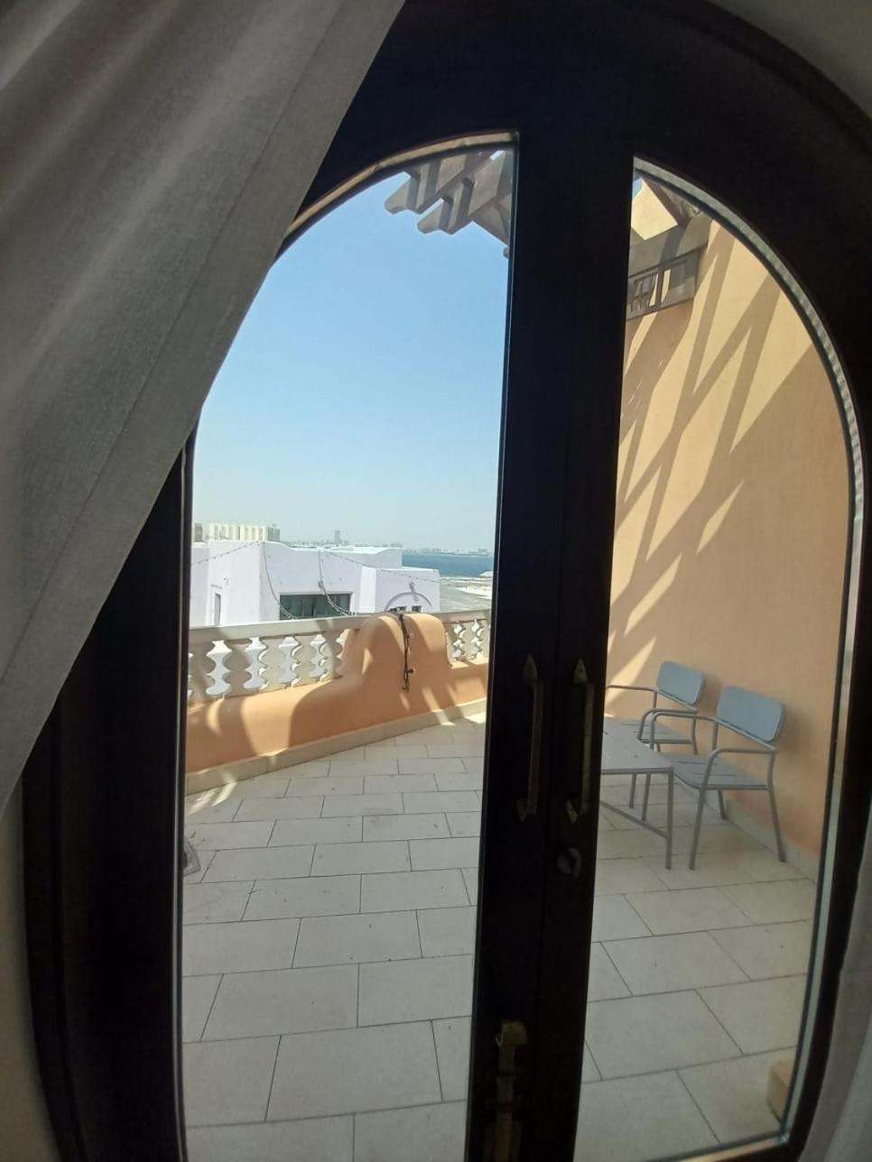 Mina Hotel And Residences By The Torch الدوحة المظهر الخارجي الصورة A view from the balcony of a suite at the hotel